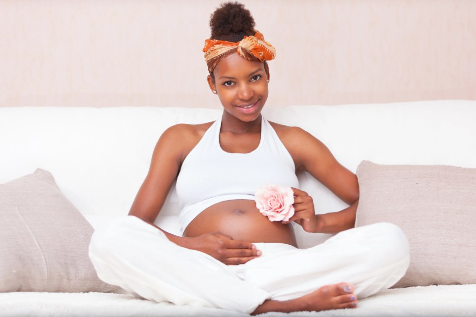 A young mother holding her child