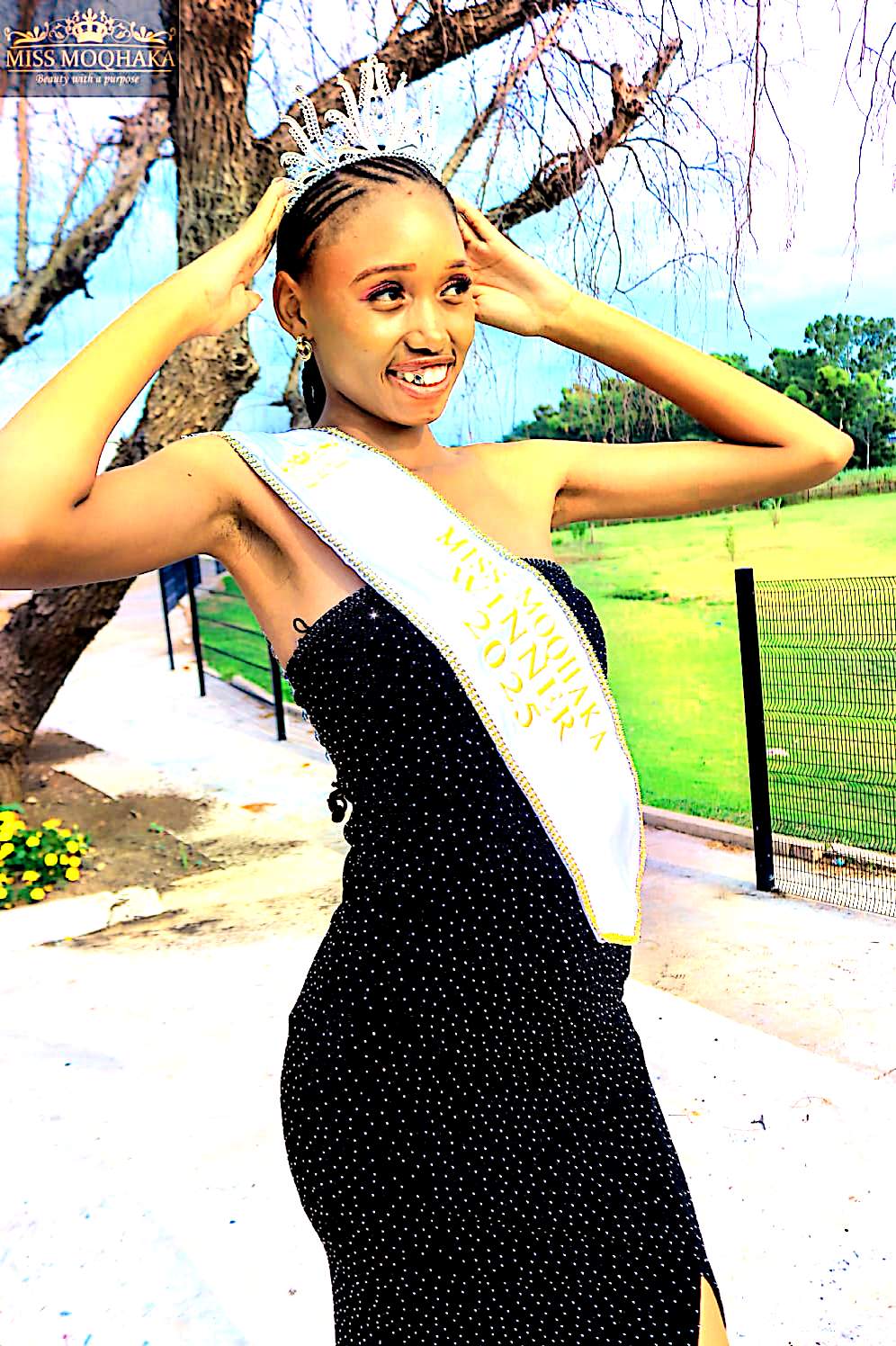 A Miss Moqhaka winner celebrating with her sash